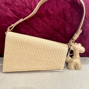 Tan Woven Shoulder Bag with Flap Closure
